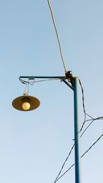 Electricity pylon against clear sky