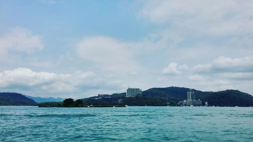 Scenic view of sea against cloudy sky