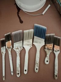 High angle view of paintbrushes on table