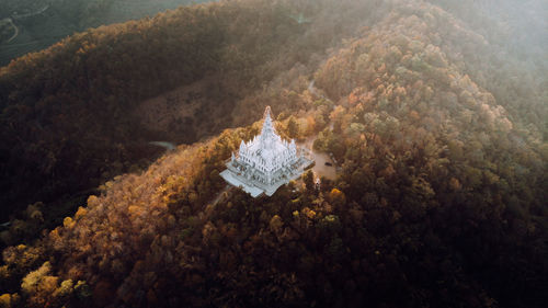 High angle view of umbrella on land by sea