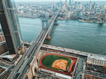 High angle view of bridge over river and buildings in city