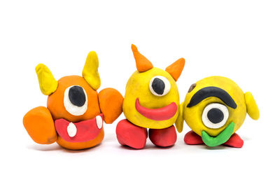 Close-up of toys over white background
