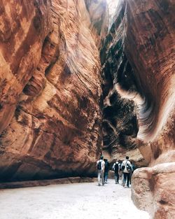 People walking in cave