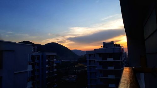 Buildings against sky during sunset