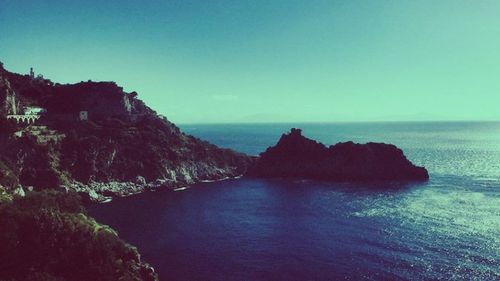 Scenic view of sea against blue sky