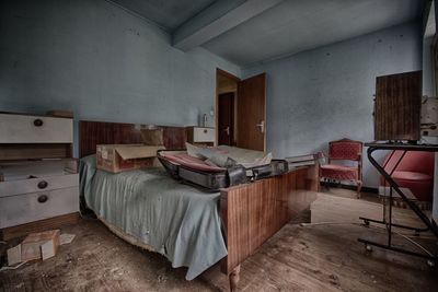 Bed and container in old abandoned building