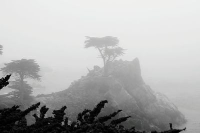 Scenic view of mountains against cloudy sky