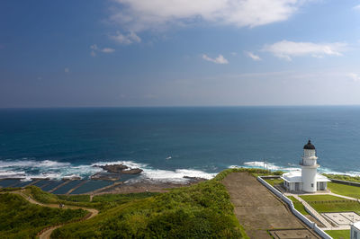 High angle view of sea and buildings against sky