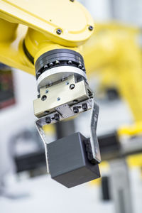 Detail of industrial robot carrying cube