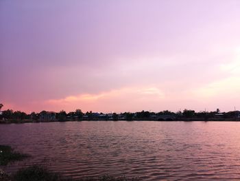 Scenic view of sea against romantic sky at sunset