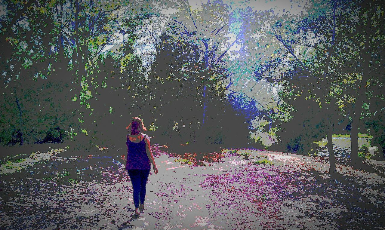 YOUNG WOMAN STANDING ON GROUND