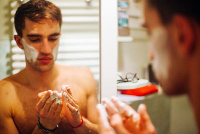 Close-up of young couple with reflection