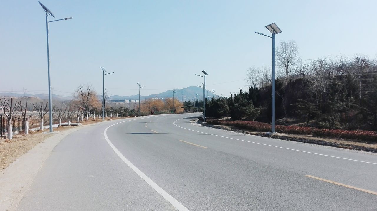 the way forward, transportation, road, road marking, clear sky, diminishing perspective, vanishing point, asphalt, country road, empty road, copy space, street, street light, empty, long, blue, electricity pylon, sky, power line, outdoors