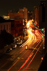 High angle view of light trails on road at night