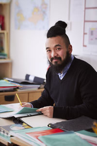 Smiling teacher looking at camera