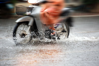 Blurred motion of man riding motorcycle