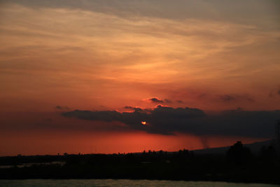 Beautiful colors of the sunset sky setting on the river