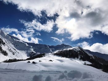 Scenic view of snowcapped mountains against sky