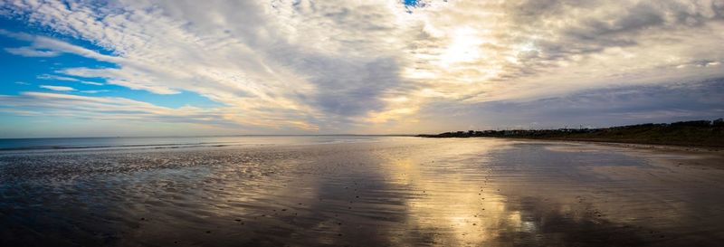 Scenic view of sea against sky at sunset