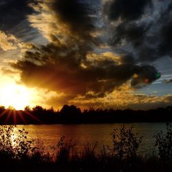 Scenic view of sunset over river