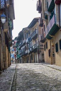 Narrow street amidst buildings in town