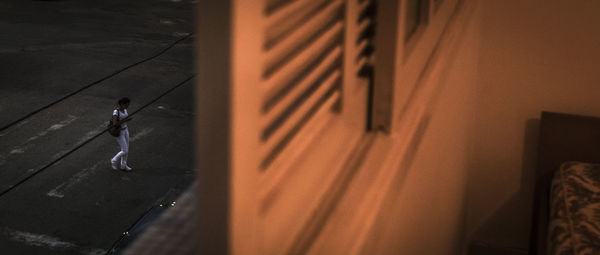 High angle view of person standing by building