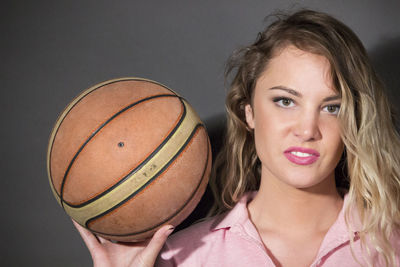 Portrait of a teenage girl holding ball