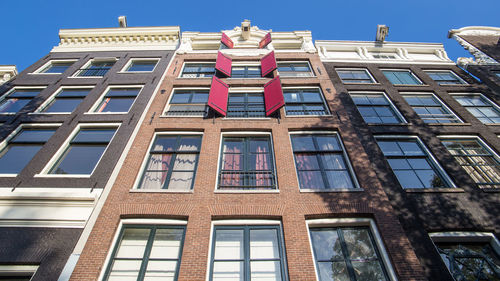 Low angle view of building against blue sky