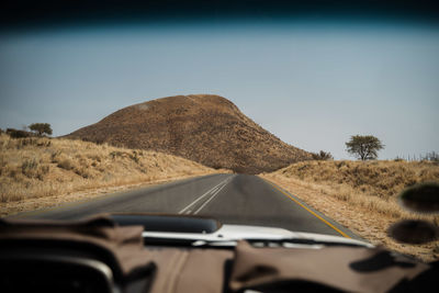 Road seen through car windshield