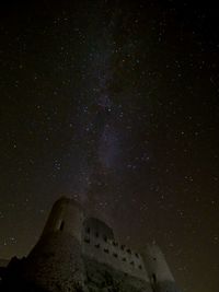 Low angle view of building against sky at night