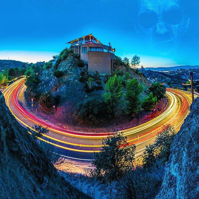 built structure, architecture, illuminated, blue, building exterior, tree, light trail, sky, long exposure, landscape, high angle view, road, mountain, panoramic, travel destinations, scenics, outdoors, nature, clear sky, multi colored