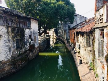 Canal amidst old buildings