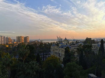 High angle view of buildings against cloudy sky