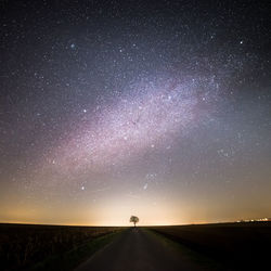 Scenic view of landscape against sky at night