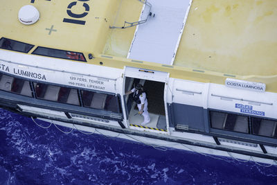 High angle view of information sign in sea