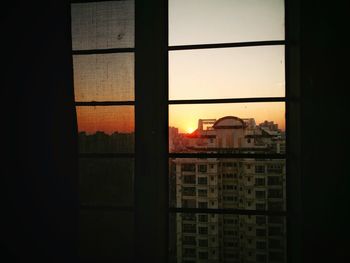 View of cityscape through window