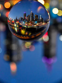 Close-up of illuminated cityscape at night