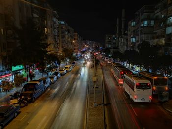 Cars on city street at night