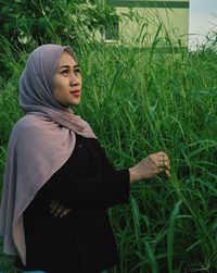 Young woman standing on field jakarta june 2021