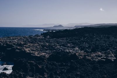 Aerial view of sea against clear sky