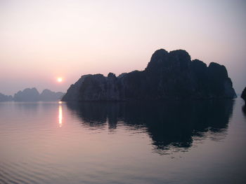 Scenic view of lake at sunset