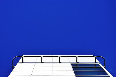 Low angle view of built structure against clear blue sky