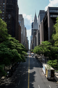 Road amidst buildings in city