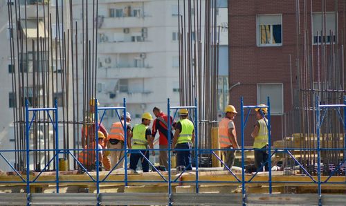 Group of people working in front of building