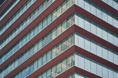 Facade fragment and modern building with glass and metallic materials 