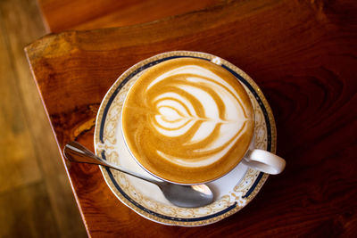 High angle view of cappuccino on table