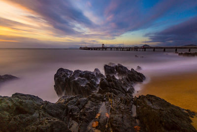 Scenic view of sea against cloudy sky