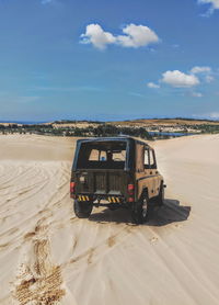 View of car on desert land