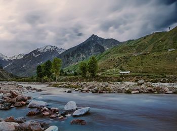 Mountains scenery. running water and stormy clouds over mountains, pakistan