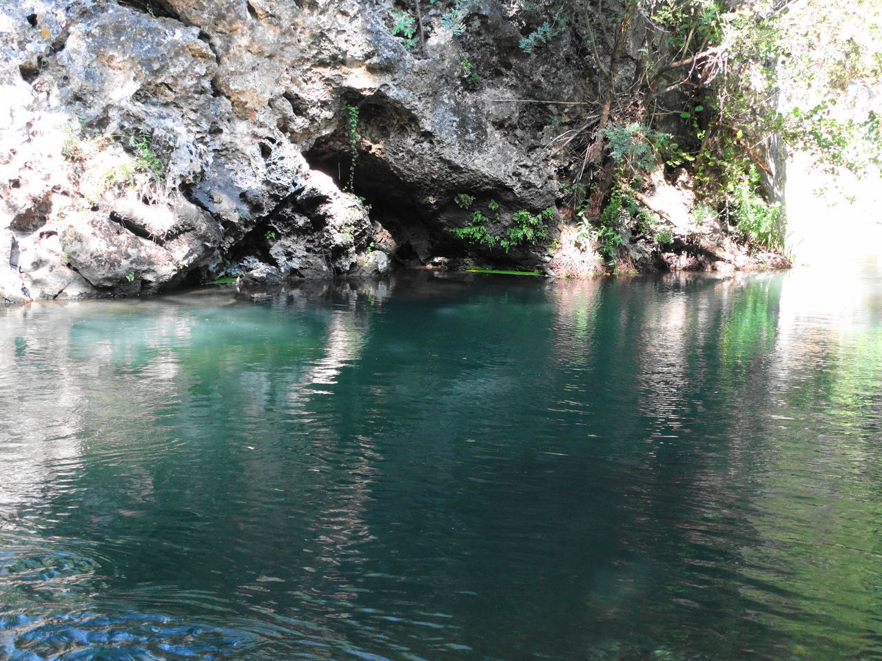 SCENIC VIEW OF ROCK FORMATION BY LAKE